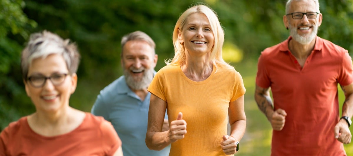 5 Benefits of Epidural Back Injections-5-Runners A group of people smile as they jog after epidural back injections
