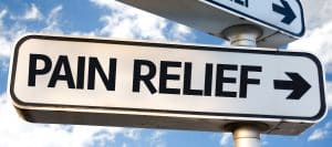 A sign that has "pain relief" on it