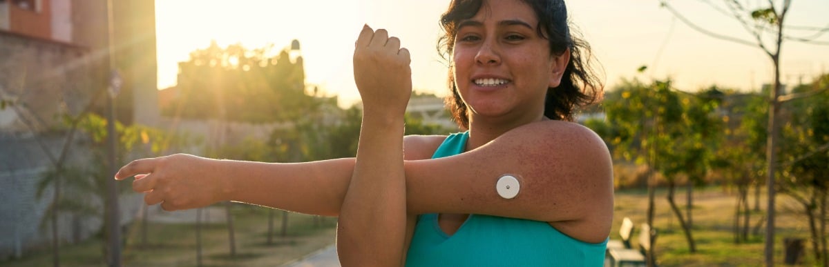 5 Facts You Didn't Know About the Diabetes Patch-3 A jogger wearing a diabetes patch stretches her arm before a run