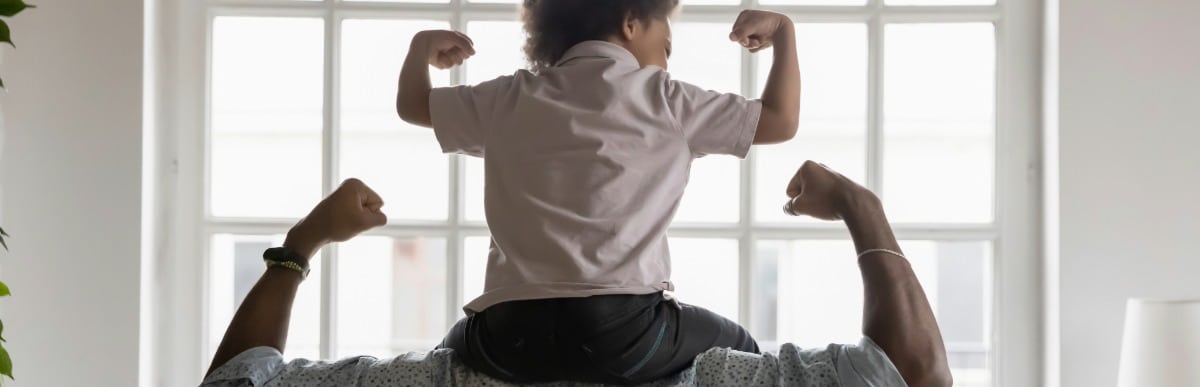 5 Types of Back Pain You Should Know-5 A father and son flex their muscles to show their strong backs