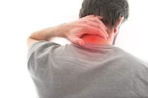 rear view of man suffering from neck pain