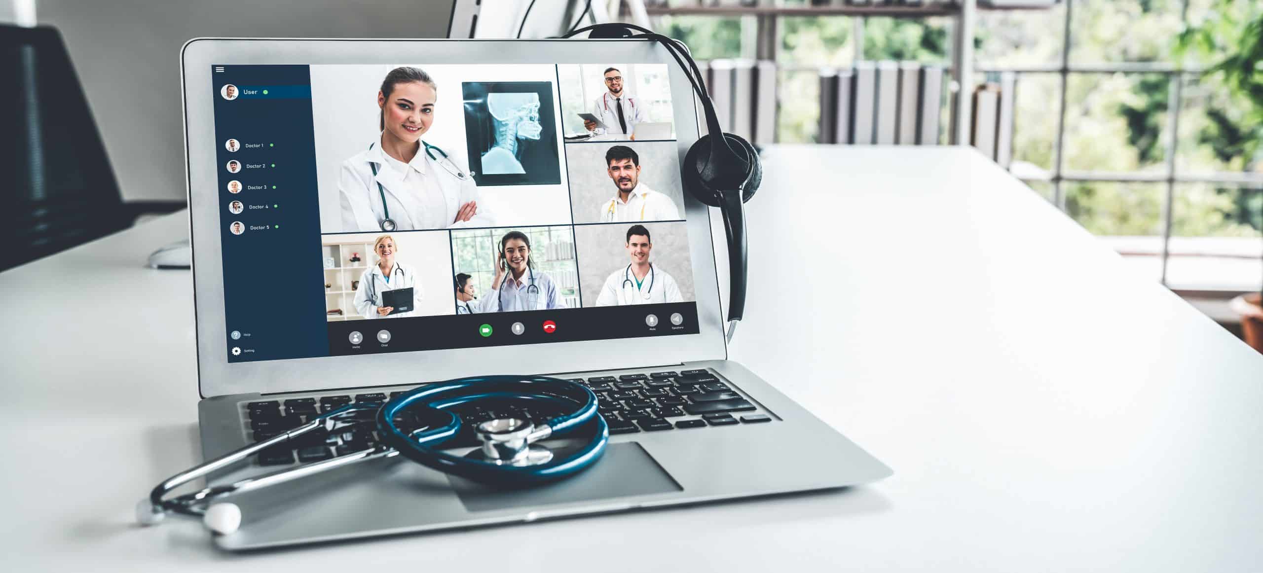 Telemedicine service online video call for doctor to actively chat with patient A laptop computer with a healthcare webinar on the screen.