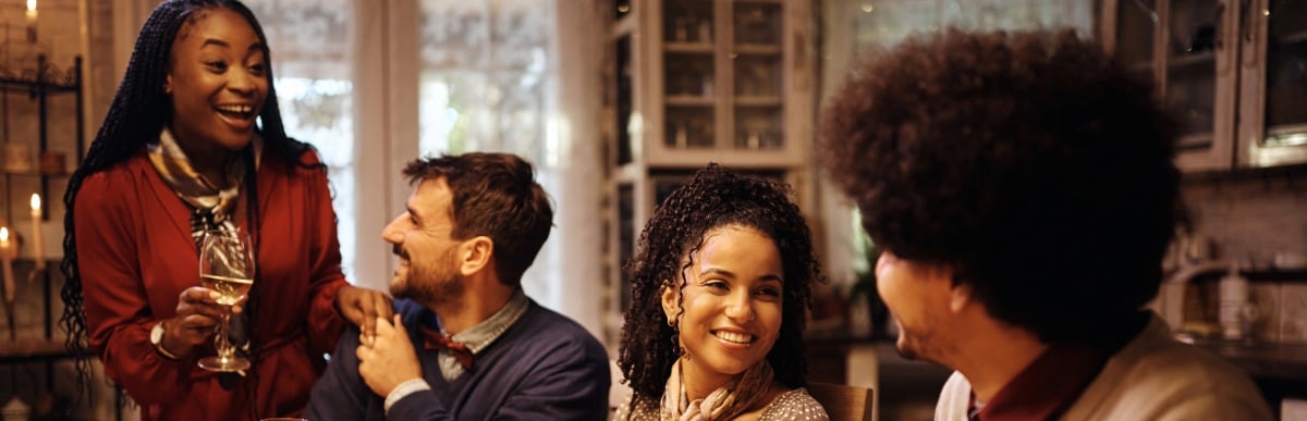 Can Electrical Stimulation Help Neuropathy in Feet-6-Dinner A family smiles as they enjoy dinner around a table