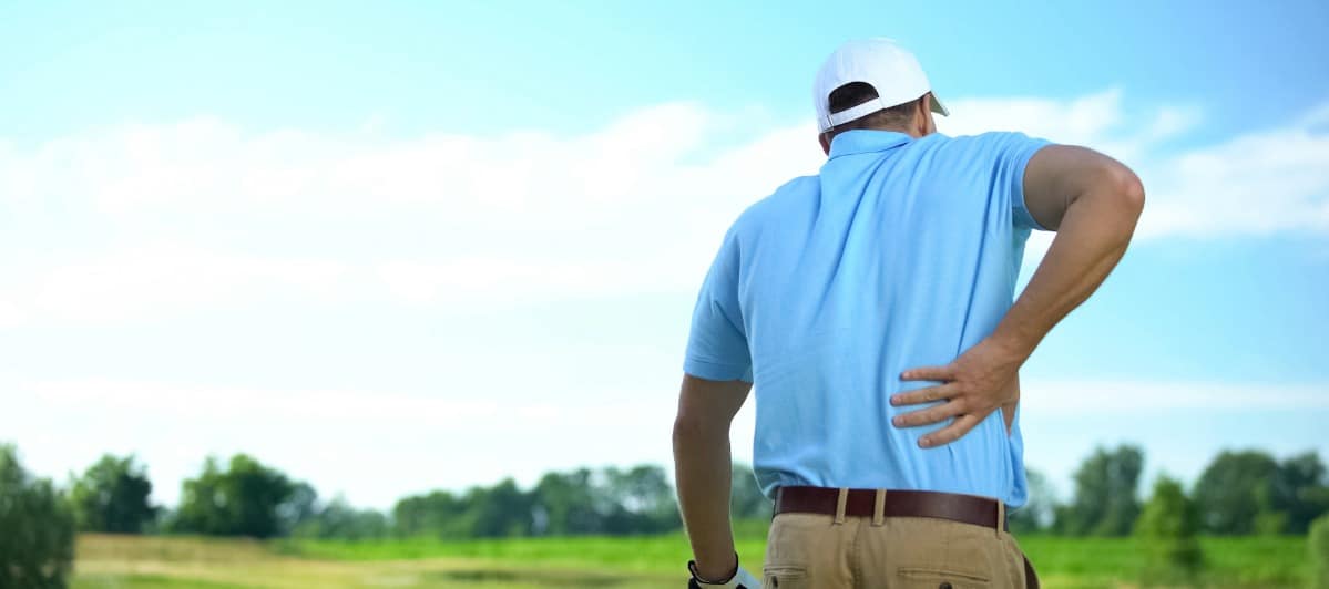 Can Epidural Injections Help Your Lower Back Pain-3-Back A golfer on the course holds his lower back in pain