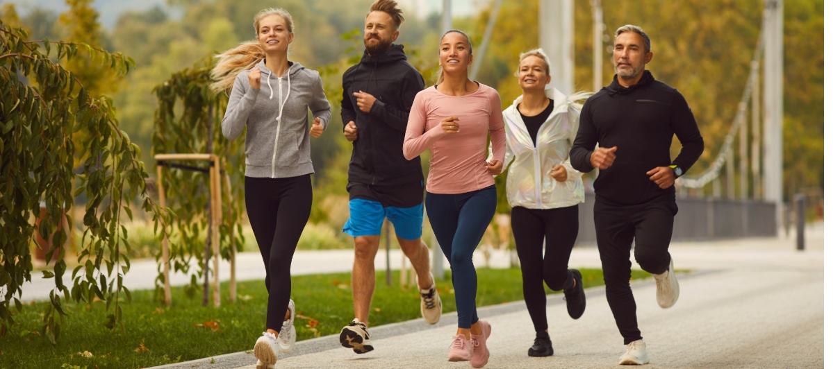 Can Weight Loss Injections Reduce Chronic Pain-4-Runners A group of runners smile as they jog through the park