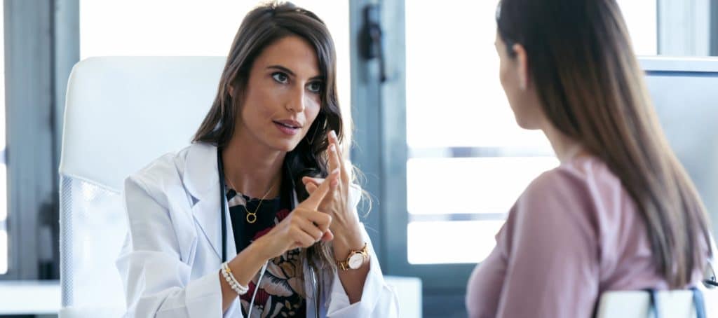 A doctor explains to her patient how to ease symptoms of diabetic neuropathy
