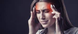 A person holding their head in pain