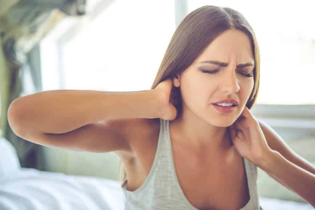 A women suffering from fibromyalgia pain.