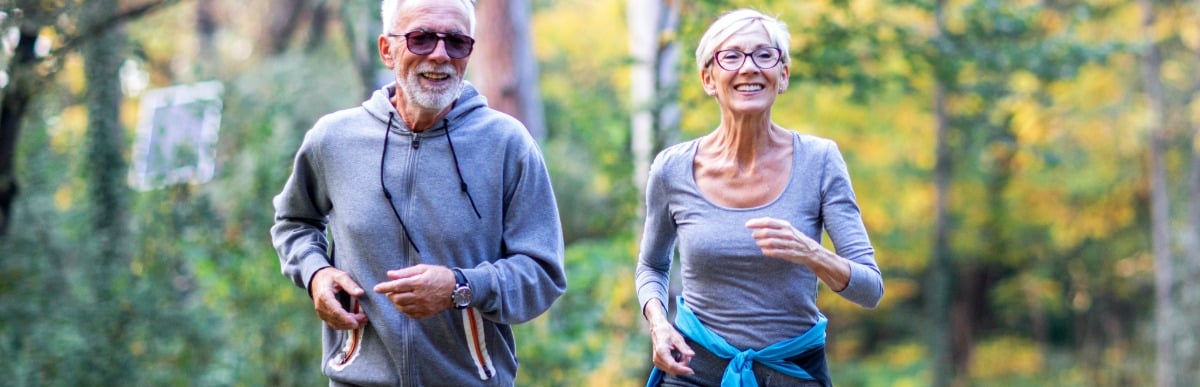 Heart Disease Symptoms You Need to Know (1) An older couple smiles as they jog after a spinal cord stimulator procedure