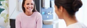 A patient listens as her doctor tells her about hormone imbalance treatment