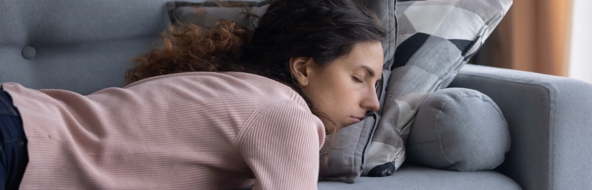 Heart Disease Symptoms You Need to Know - 2026-06-05T063520.473 A woman in need of hormone imbalance treatment feels fatigued and lies on a couch