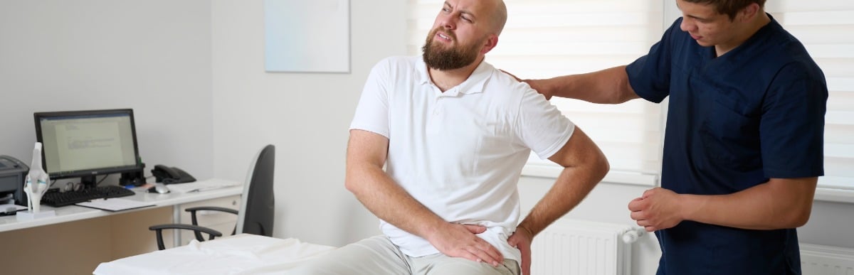A patient gets examined by his doctor for musculoskeletal pain in his hip