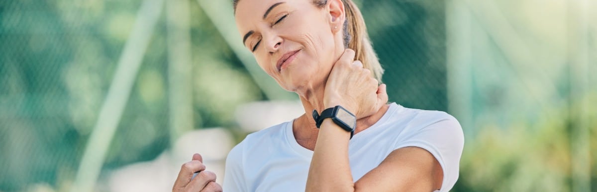 Heart Disease Symptoms You Need to Know - 2026-06-10T115118.354 A woman holds her neck due to nerve pain