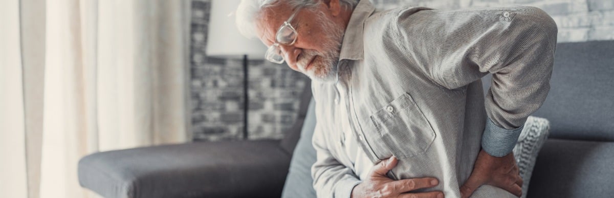 Heart Disease Symptoms You Need to Know - 2026-06-16T103622.266 An older man in need of regenerative medicine treatment holds his back in pain