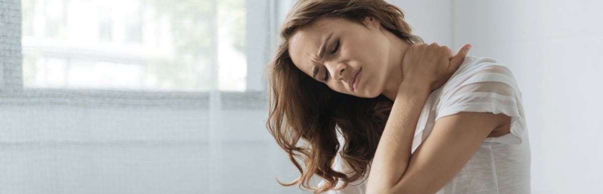 Heart Disease Symptoms You Need to Know - 2026-06-25T102645.228 A woman holds her neck due to hormones and pain due to inflammation