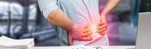 A man holds his back in pain before The Intracept Procedure