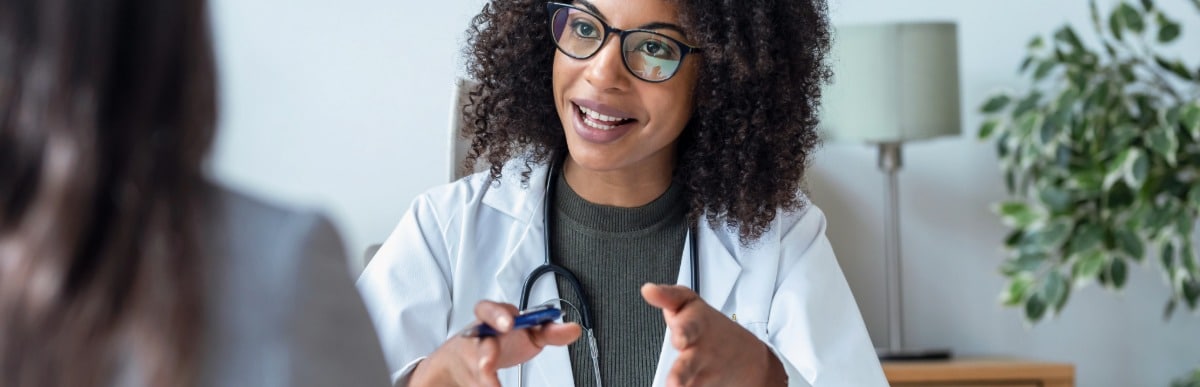Heart Disease Symptoms You Need to Know - 2026-07-08T094443.377 A doctor in a lab coat tells her patient about The Intracept Procedure