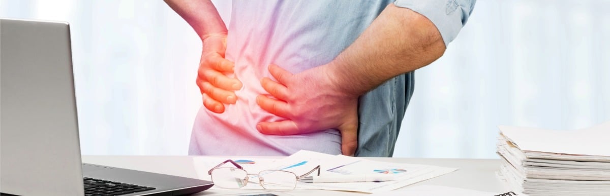 Heart Disease Symptoms You Need to Know - 2026-07-15T110652.756 A man in need of a spinal cord stimulator procedure holds his back in pain