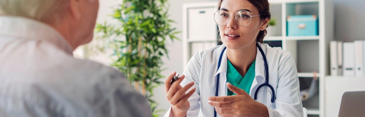 Heart Disease Symptoms You Need to Know - 2026-07-15T110840.363 A doctor in a lab coat tells her patient about the spinal cord stimulator procedure
