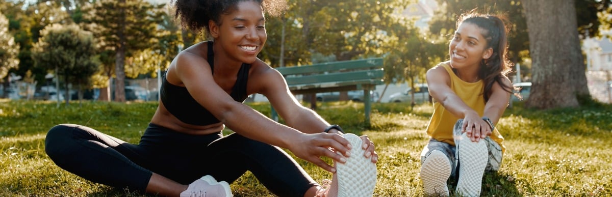 Heart Disease Symptoms You Need to Know - 2026-08-20T112629.064 Two friends smile as they stretch before a run in the park
