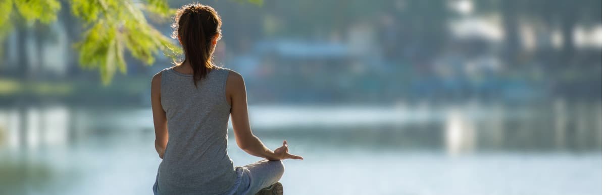 Heart Disease Symptoms You Need to Know - 2026-08-27T091730.342 A woman meditates by a lake after Emsculpt Neo treatment