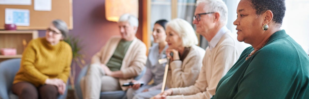 Heart Disease Symptoms You Need to Know (47) A support group of people with arthritis listen as a group member describes the early signs of autoimmune arthritis