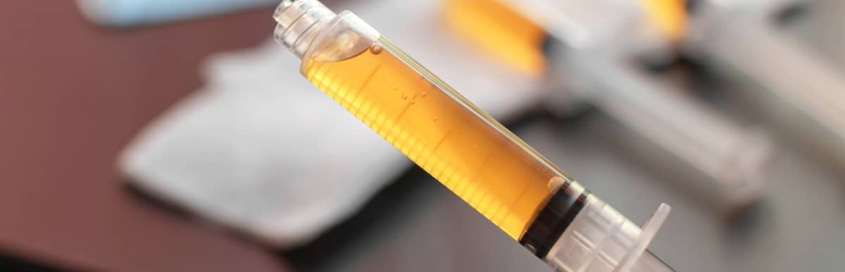 Heart Disease Symptoms You Need to Know (89) An injection needle for platelet-rich plasma treatment is shown