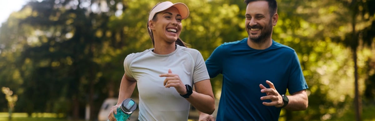 Heart Disease Symptoms You Need to Know (90) Two joggers laugh as they run through a park after functional rehabilitation