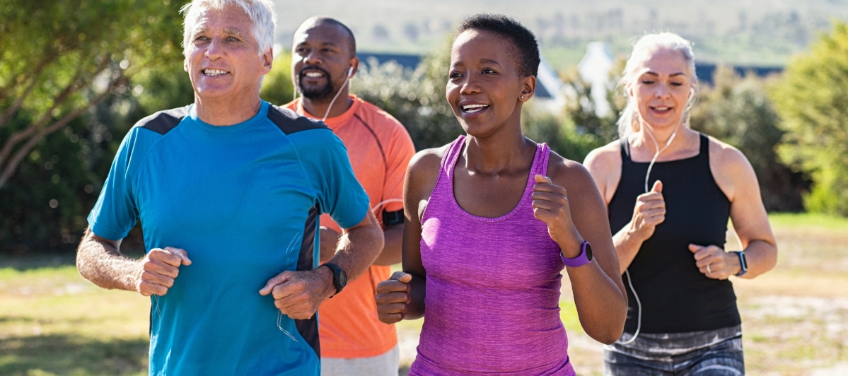 Relieving Trigeminal Neuralgia with Peripheral Nerve Stimulation-4-Joggers A group of people smile as they jog through a park
