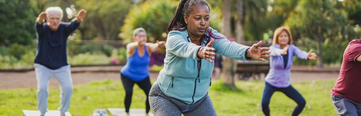 Stage 2 Hypertension When Blood Pressure Gets Serious-2 A woman extends her arms forward as she exercises in the park to manage her hypertension