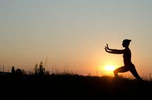 Person practicing Tai Chi for balance and wellness