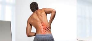 Person grabbing their back in pain