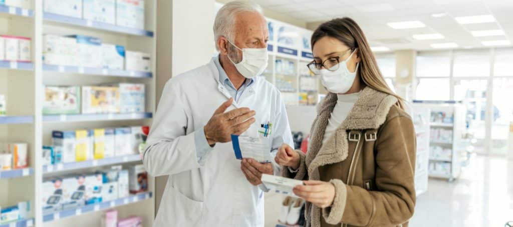 A pharmacist instructs a patient about her diabetic neuropathy medication