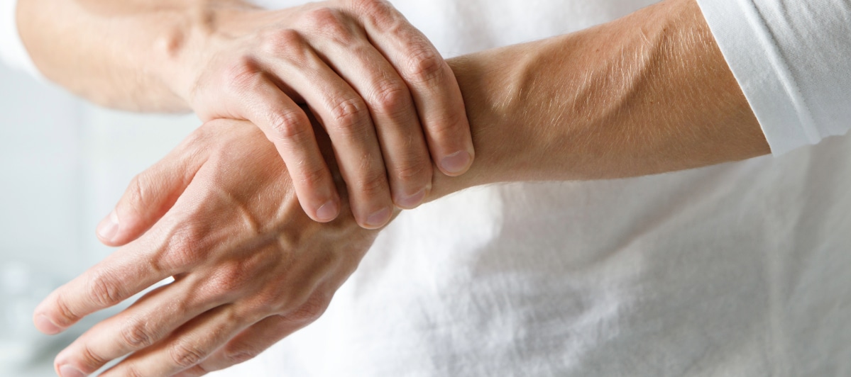 The Role of Steroid Injections in Arthritis Treatment-3-Arthritis A person grabs their wrist due to arthritis pain