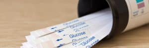 Many glucose measuring strips on a table