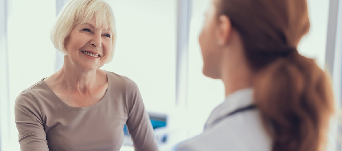 The Science Behind Platelet-Rich Plasma Therapy-6-Patient A patient smiles as she talks to her doctor about platelet-rich plasma