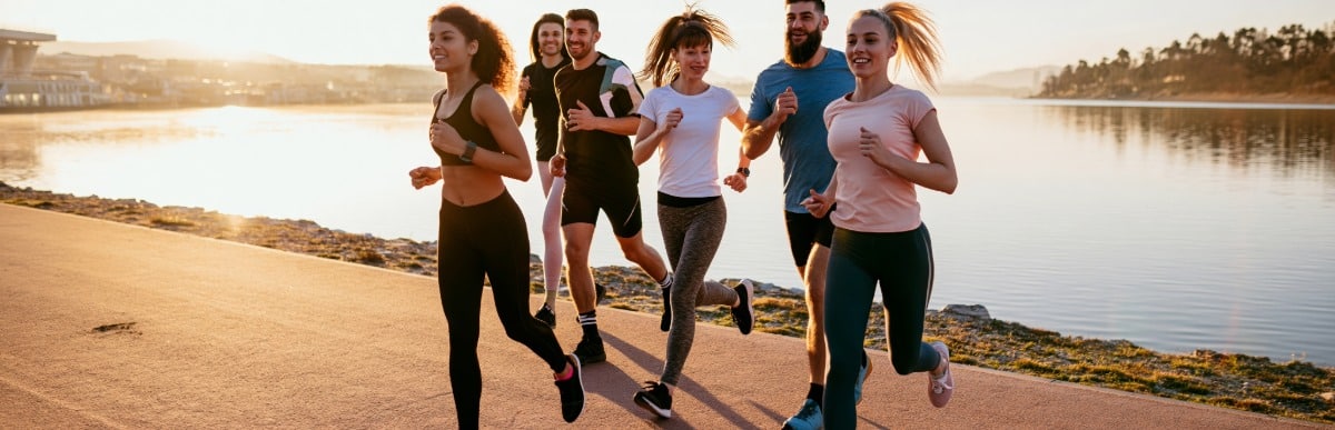 A woman jogs with her friends after Emsculpt Neo treatment