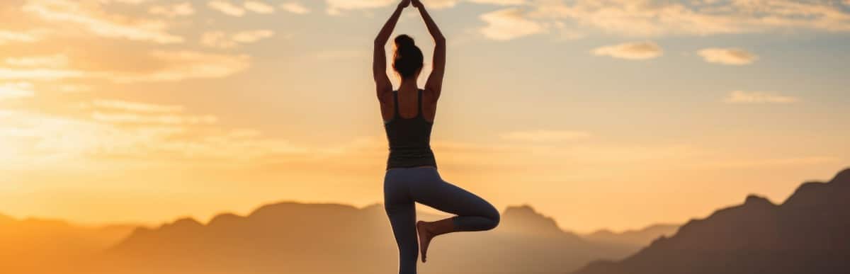 The Ultimate Guide to Vitamins for Gut Health - 2026-09-03T092146.274 A woman holds a yoga pose on a mountaintop with improved flexibility after Emsulpt Neo treatment