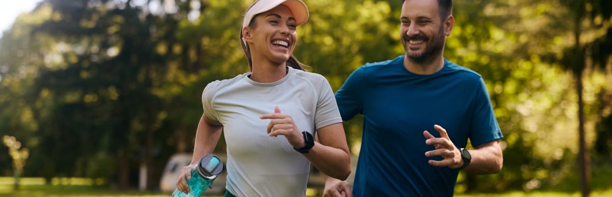 The Ultimate Guide to Vitamins for Gut Health - 2026-09-03T092540.945 A woman who has experienced Emsculpt Neo treatment smiles as she jogs in the park with a man