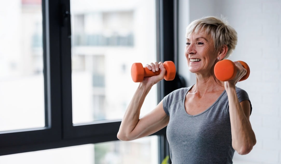The Ultimate Guide to Vitamins for Gut Health - 2026-09-10T103734.063 A woman smiles as she lifts weights at the gym after Emsculpt Neo muscle toning