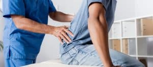 An image of a pain management doctor evaluating a pain patient