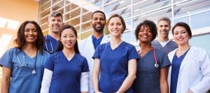 Different types of doctors all standing next to each other.