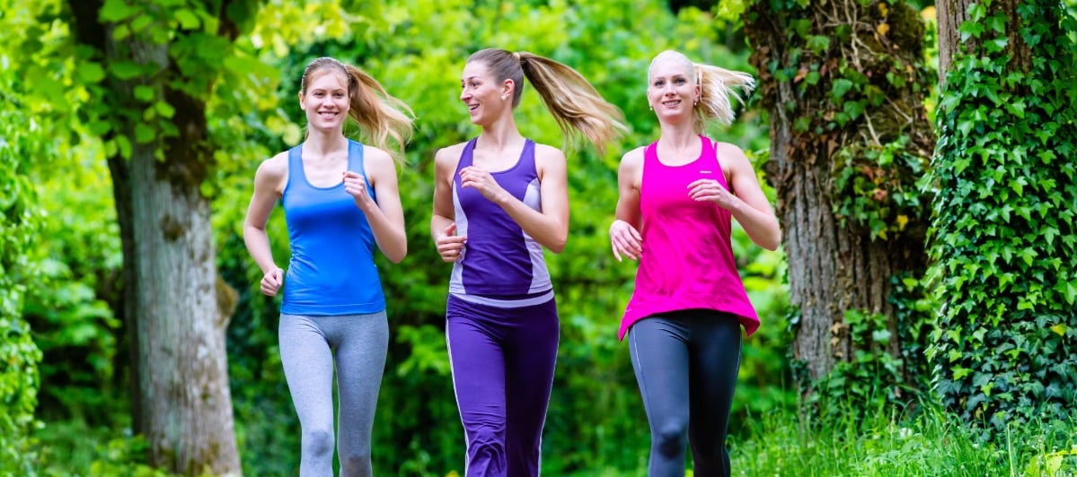Understanding Spinal Decompression What You Need to Know-6-Walkers A group of women smile as they take a brisk walk after spinal decompression