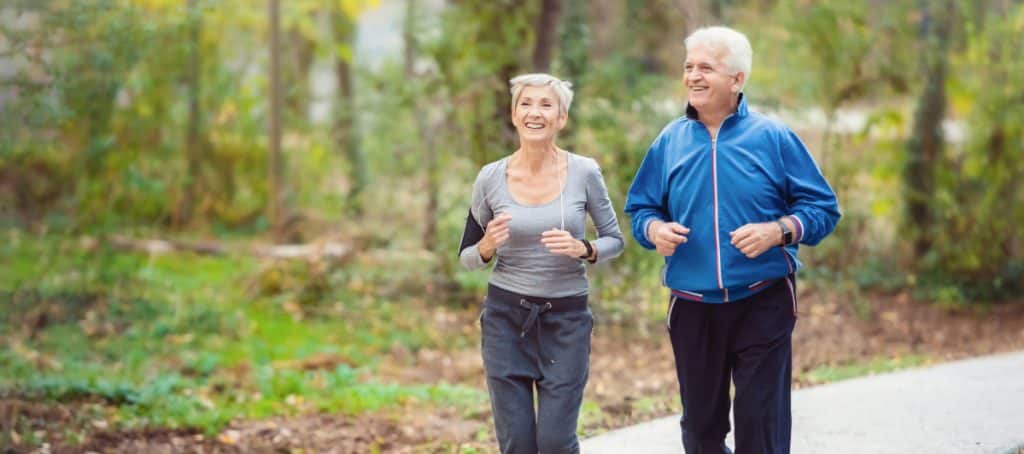 An older couple smiles as they take a job to combat the stages of diabetic neuropathy