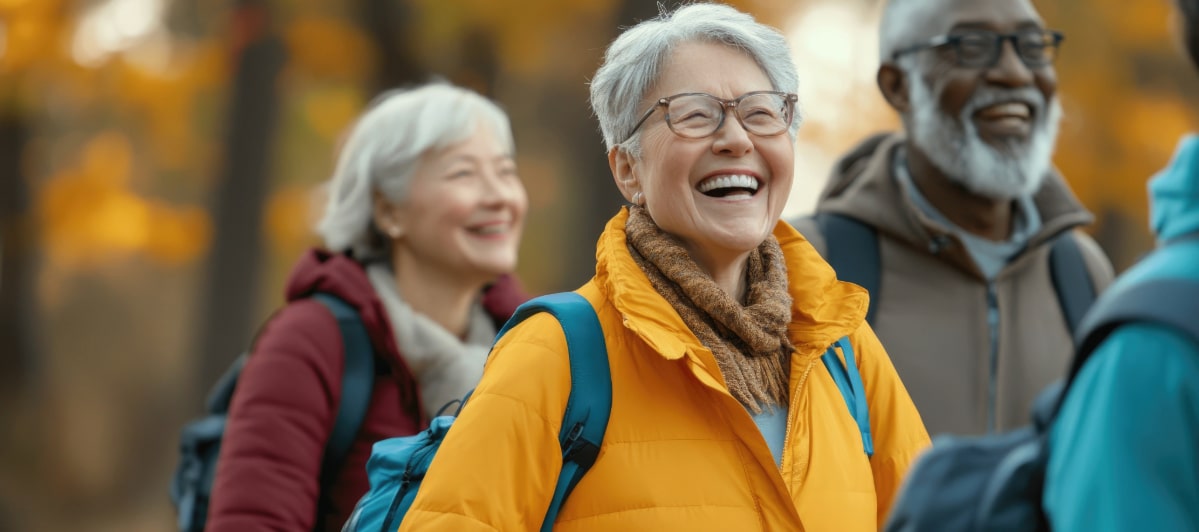 What Alternative Medicine Can Do For You-4-Hikers A group of older hikers laugh as they walk through the woods