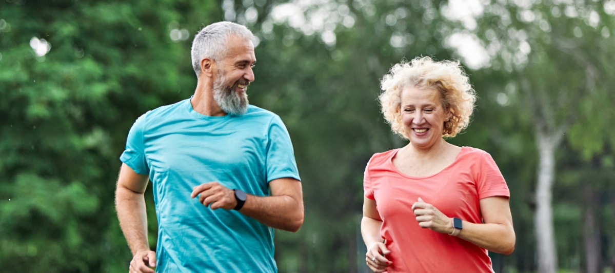 What Should I Know About Kyphoplasty-3-Runners A couple smiles as they jog together after kyphoplasty