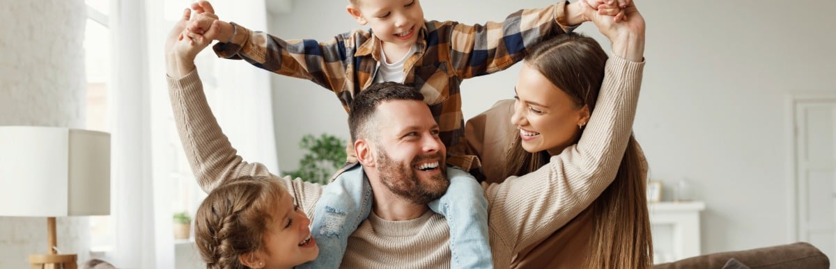 Why CGMs Are Changing Diabetes Care-4 Two parents smile as they play with their children