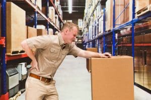 A ware house worker suffing from a Workplace injuries