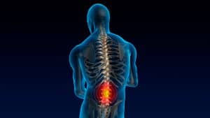 Person holding lower back showing pain